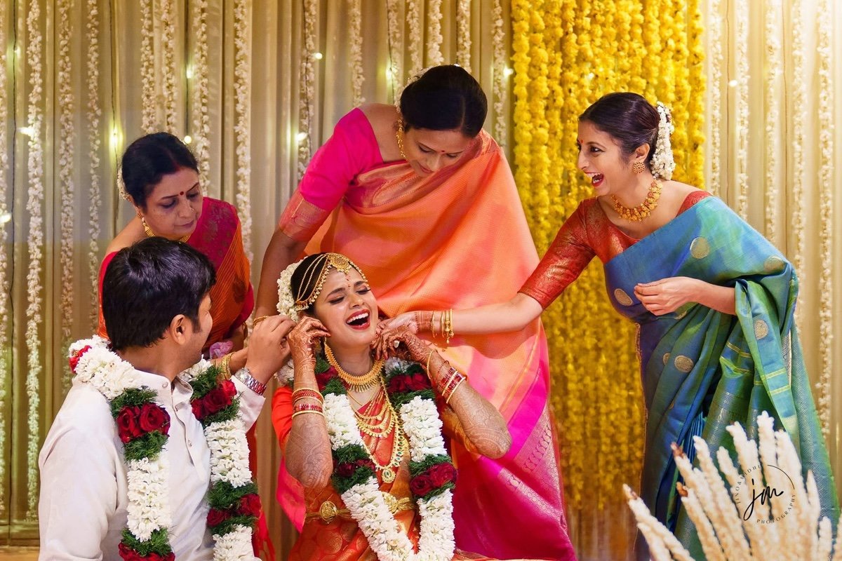 Unscripted laughter and genuine moments between bride and family by Jino and Midhu